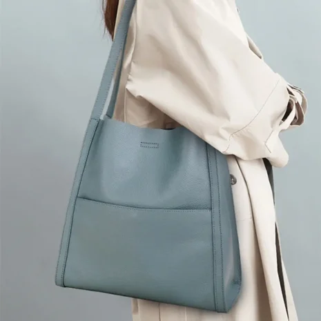 model carrying large tote bag
