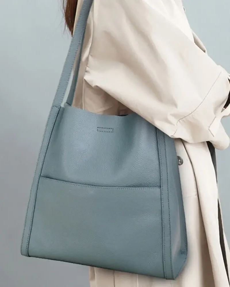 model carrying large tote bag