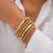 Gold stacked bracelet model