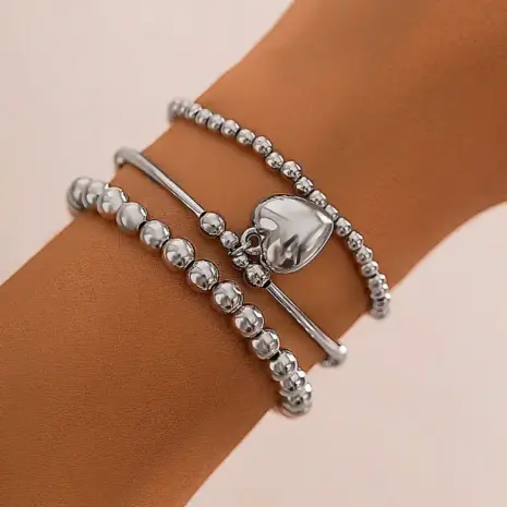 model with silver bracelet stack