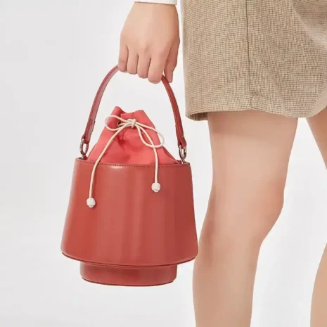 red leather bucket bag