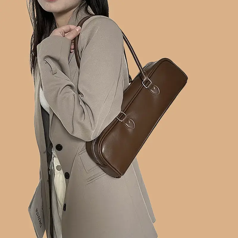brown cylinder handbag