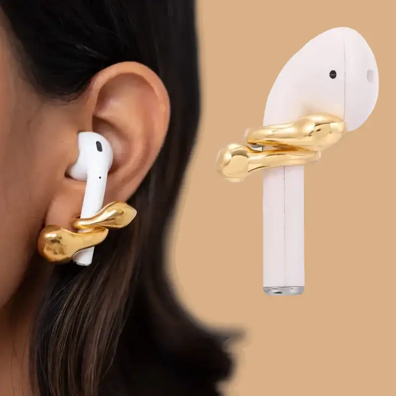 gold earphone earrings model display