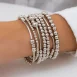 model with Silver Stackable Bracelets